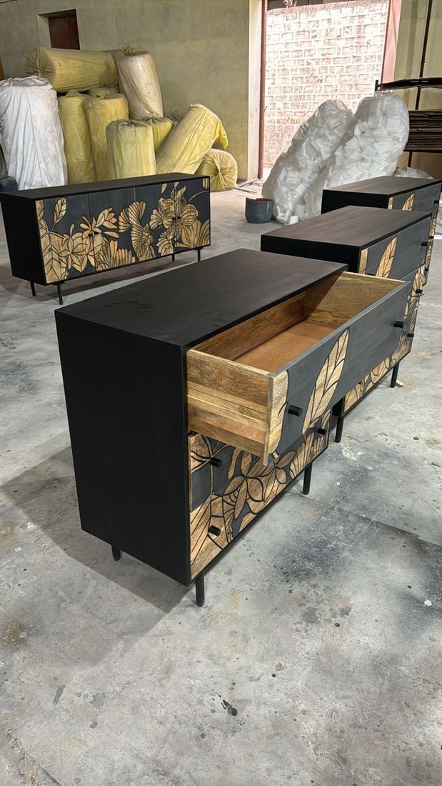 Chests with carved mango-wood fronts, a drawer opened for checking