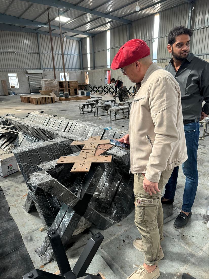 Reviewing wrapped metal X-bases and their mounting plates with the buyer