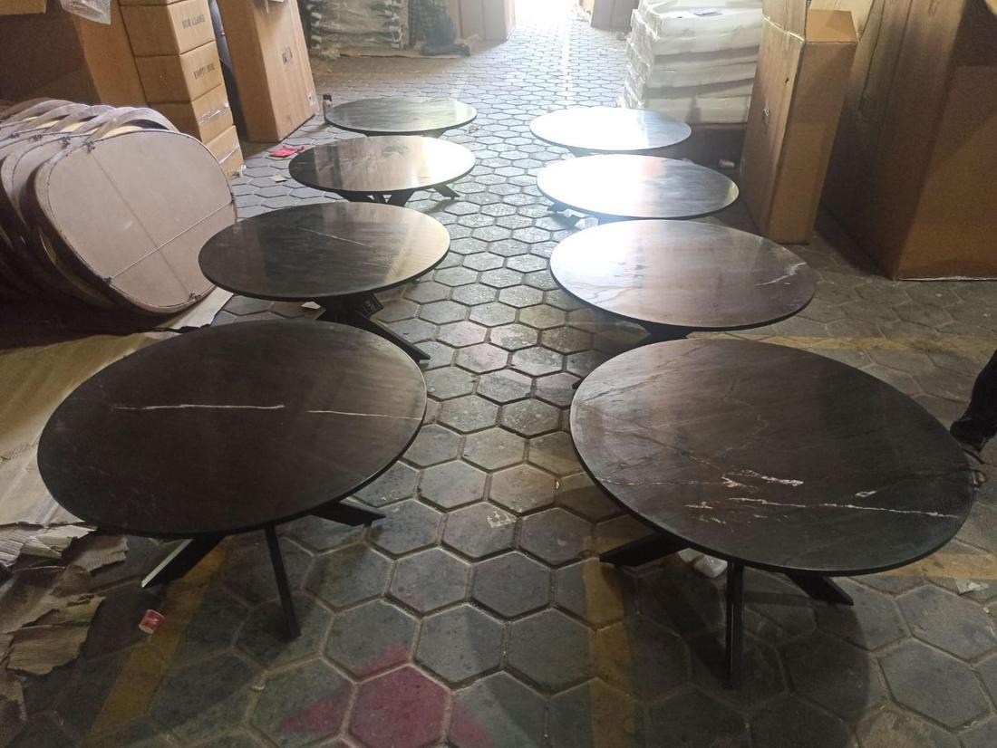 Marble-top tables laid out for checking