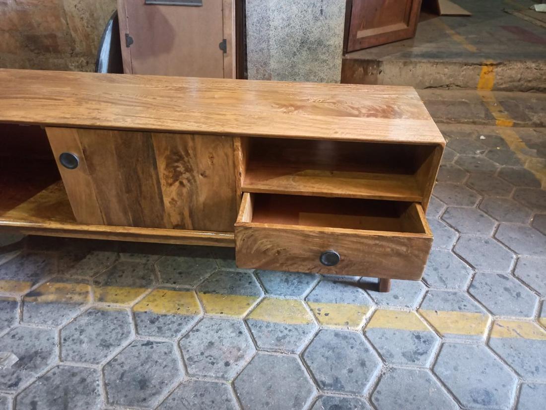 TV unit with a drawer opened for checking
